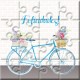 Puzzle bicicleta con la frase “Felicidades” en lata